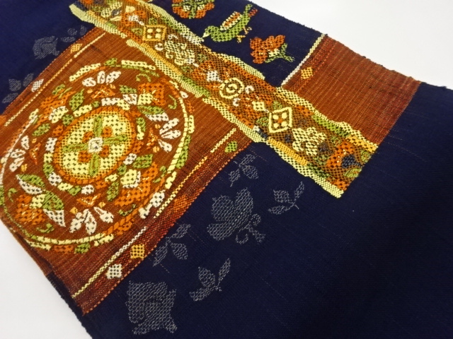 手織り真綿紬花鳥に幾何学模様織出し名古屋帯